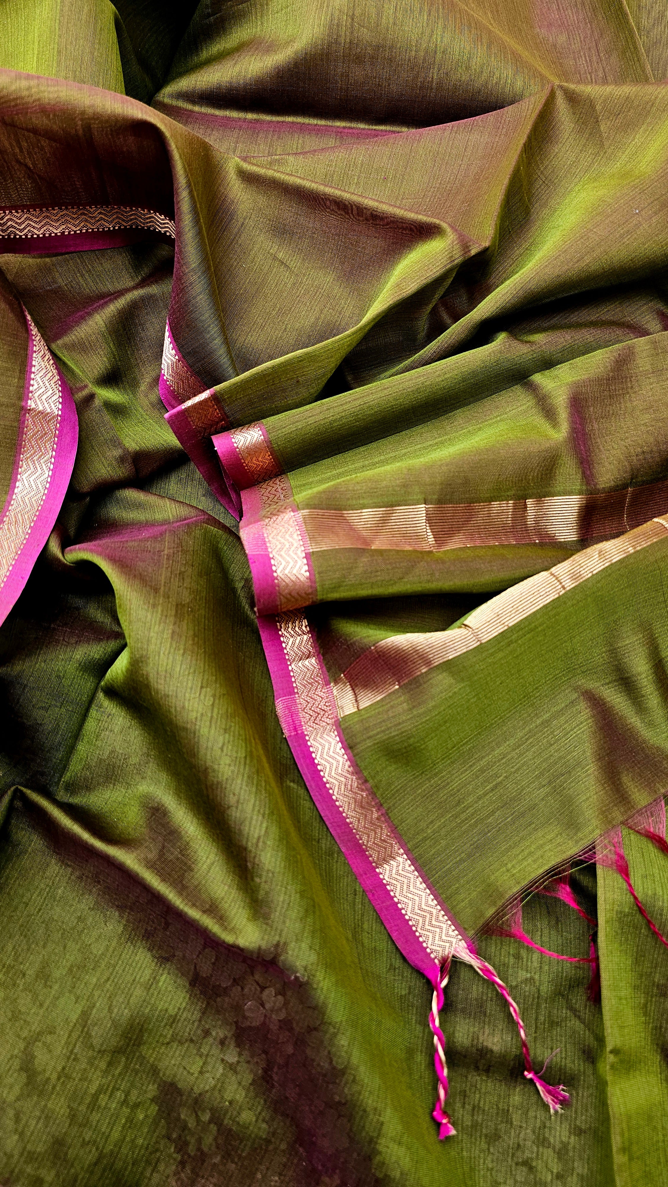 Dupatta in cross shade of Green and Rani Pink with Gold Zari Borders.