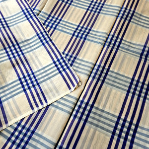 Beige and Blue bold Checks running Fabrics.