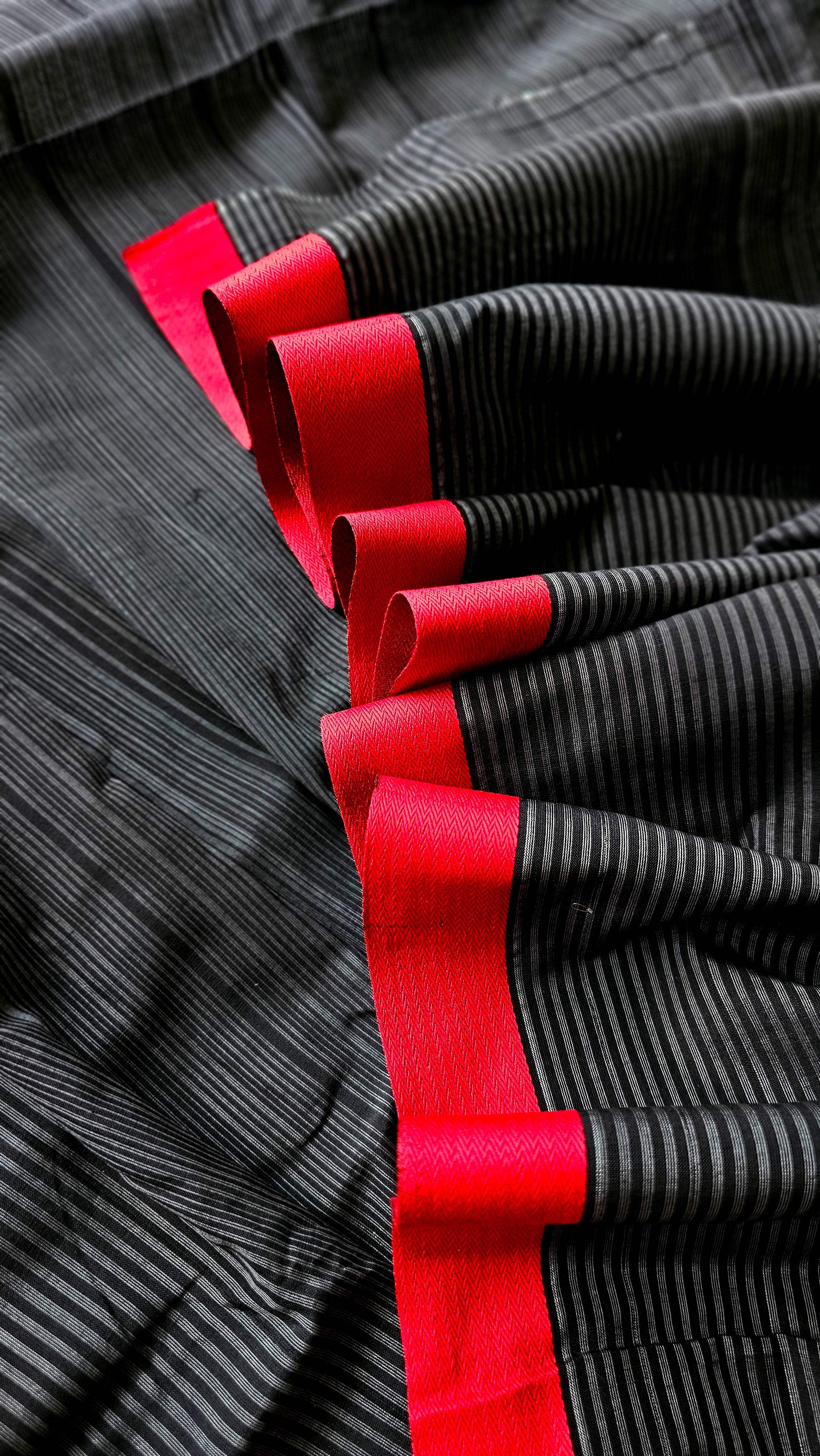 Black and White uneven Warp Stripes Fabric with Red Woven Borders