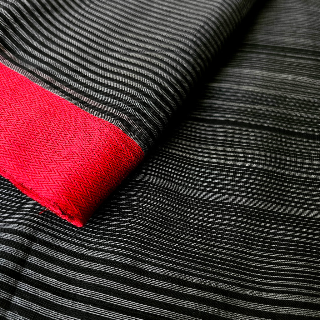 Black and White uneven Warp Stripes Fabric with Red Woven Borders