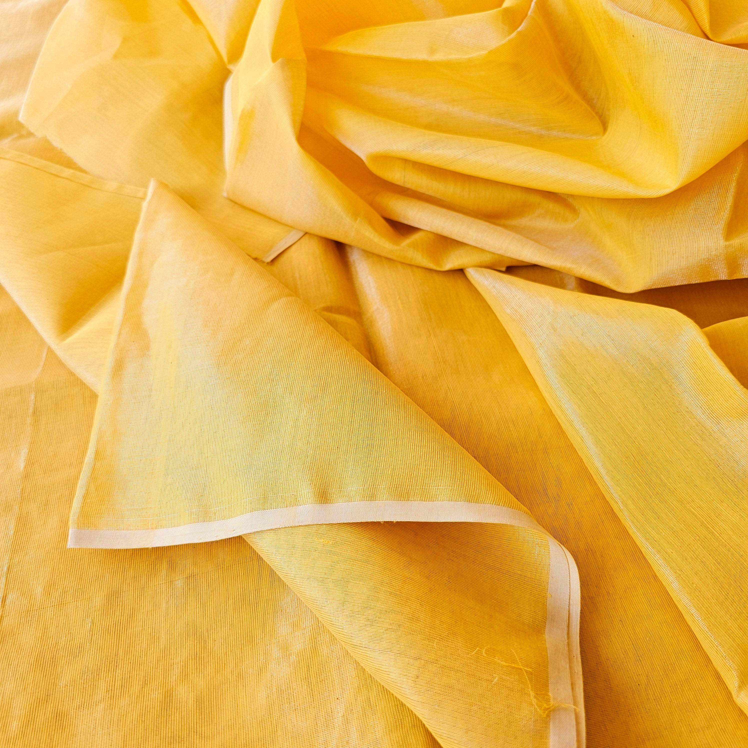 Gold Tissue Fabric in a shade of Yellow.