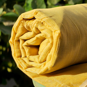 Gold Tissue Fabric in a shade of Yellow.