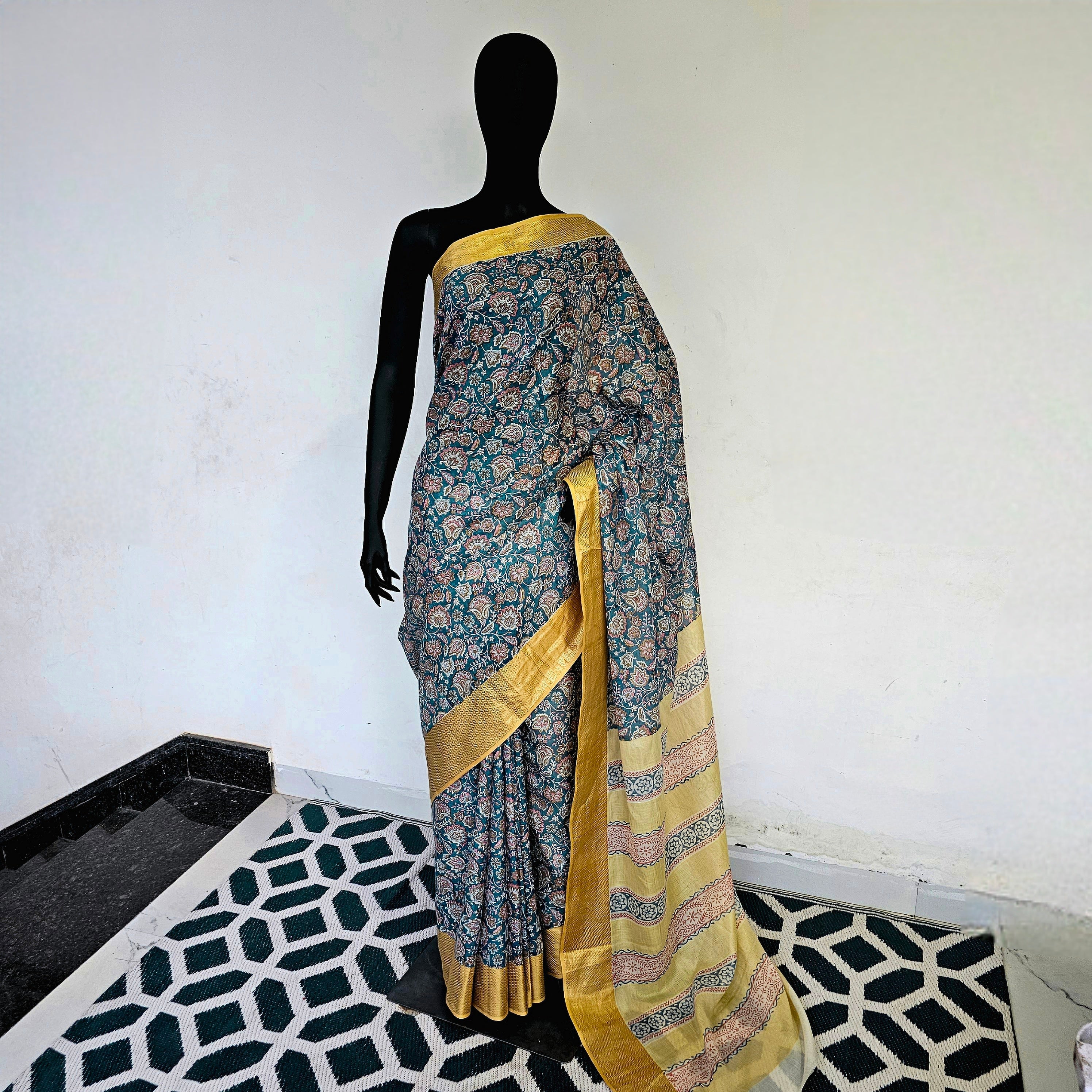 Saree with Prints and Gold Zari Borders.