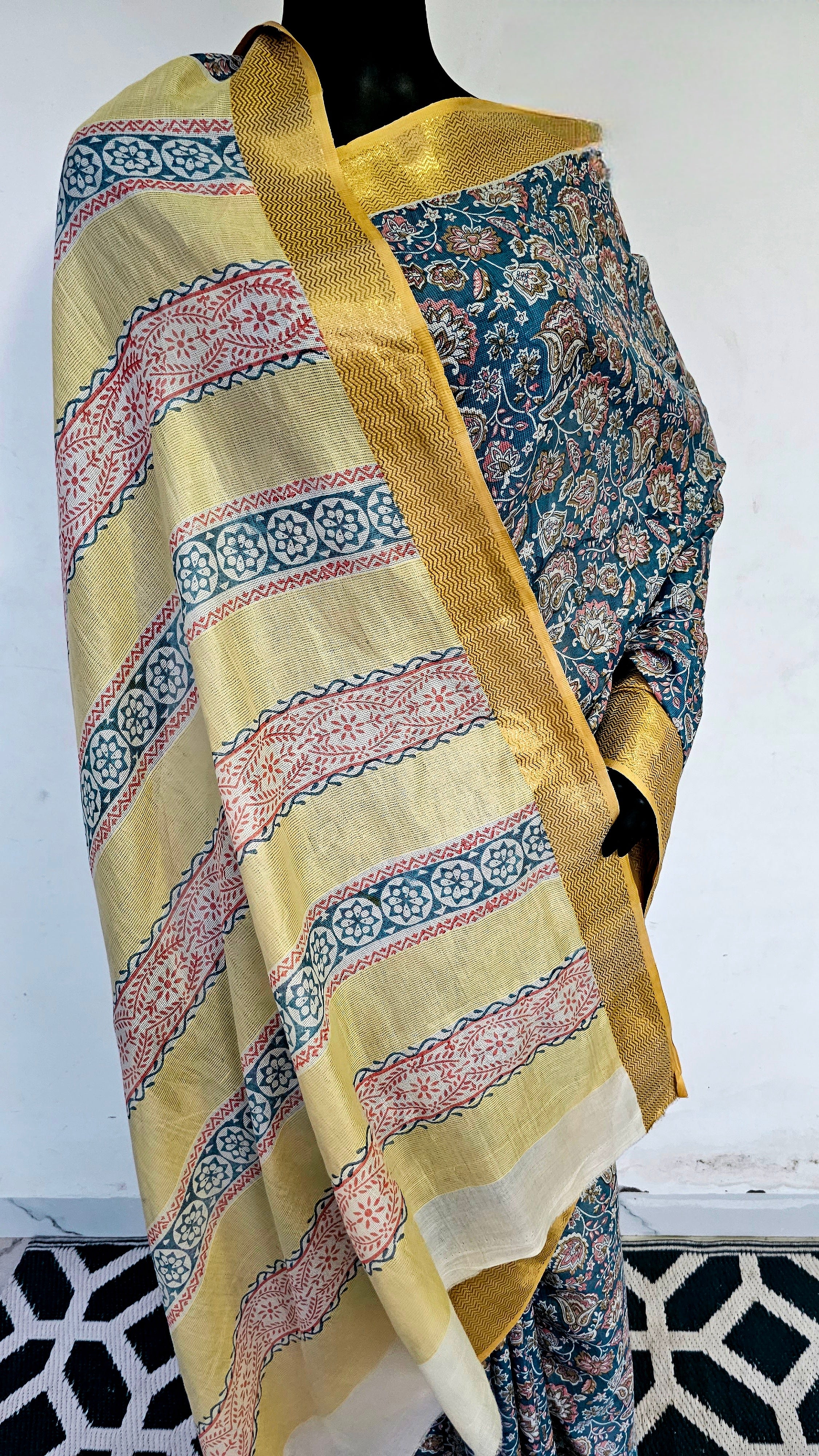 Saree with Prints and Gold Zari Borders.