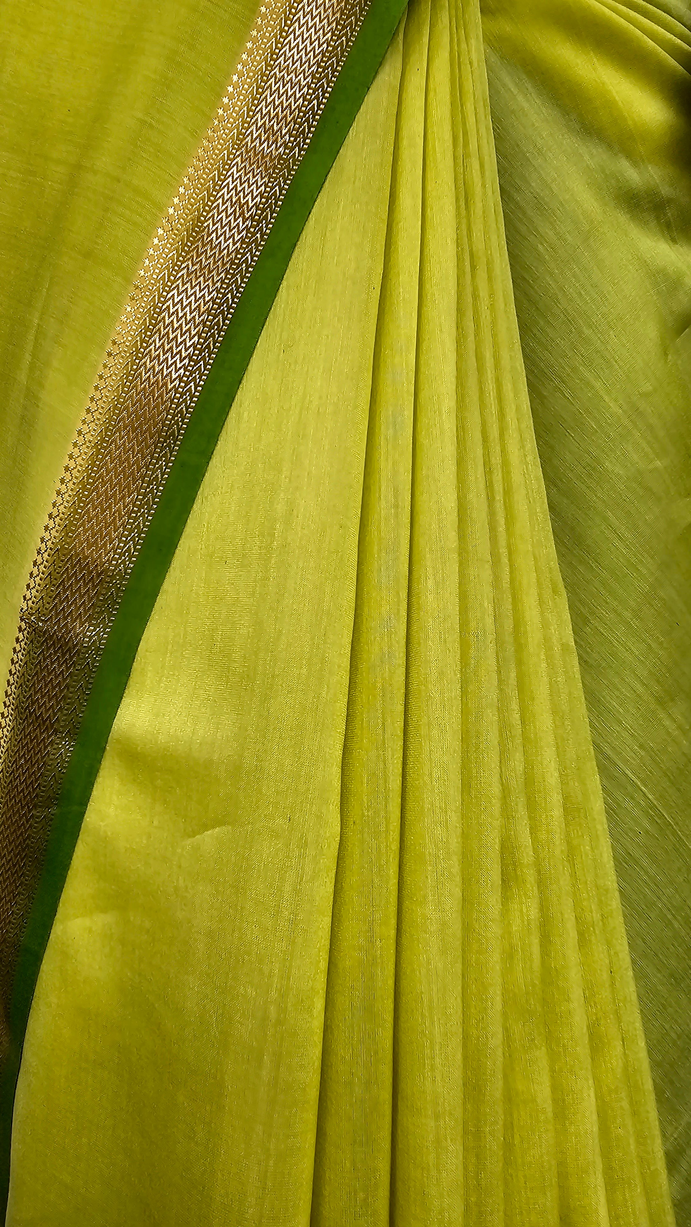 Lime Green Saree with Forest Green Pallu and Blouse with Gold Zari Borders.