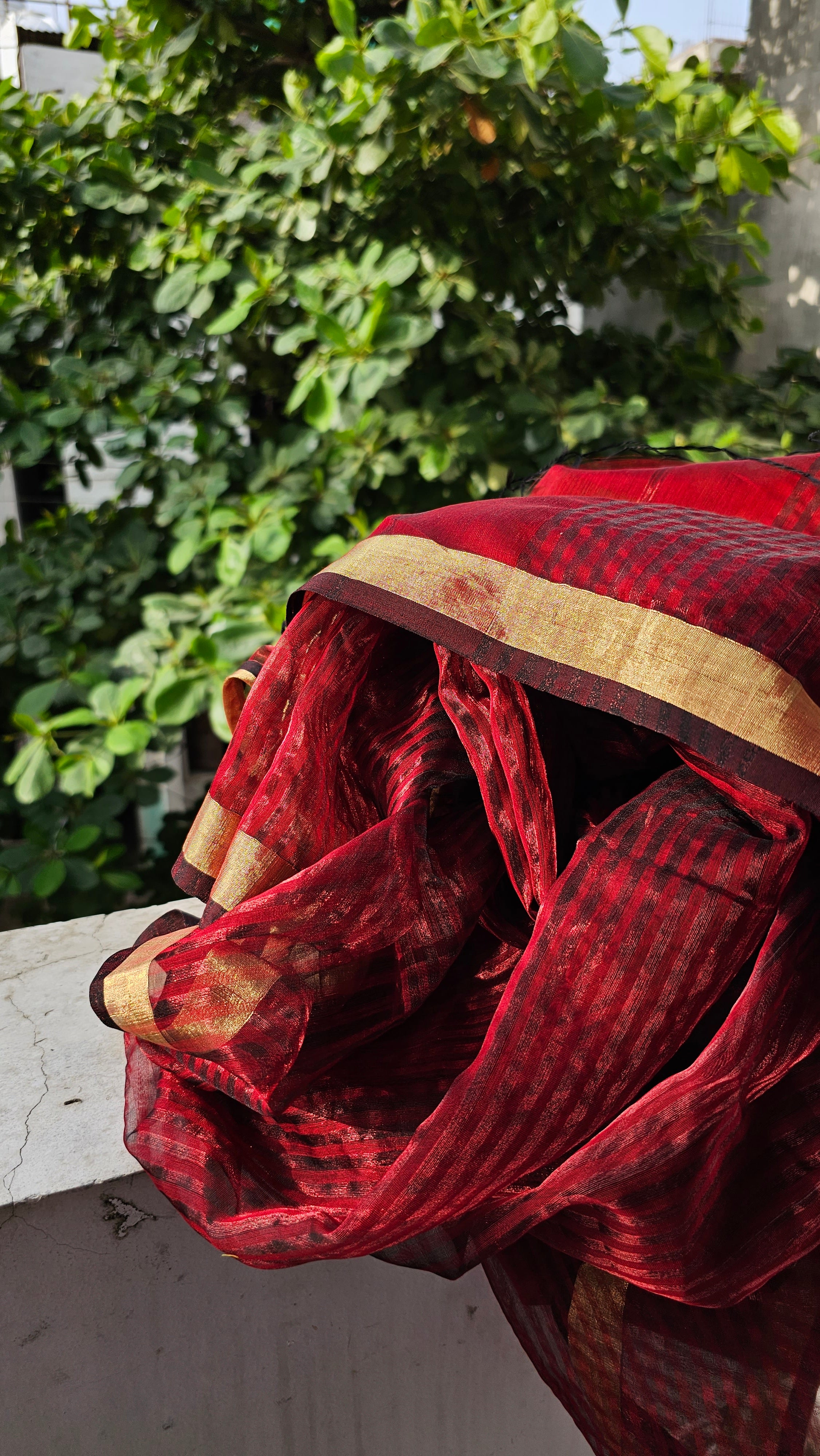 Saree with Maroon Colored Zari Weft Stripes and Flat Gold zari Borders.