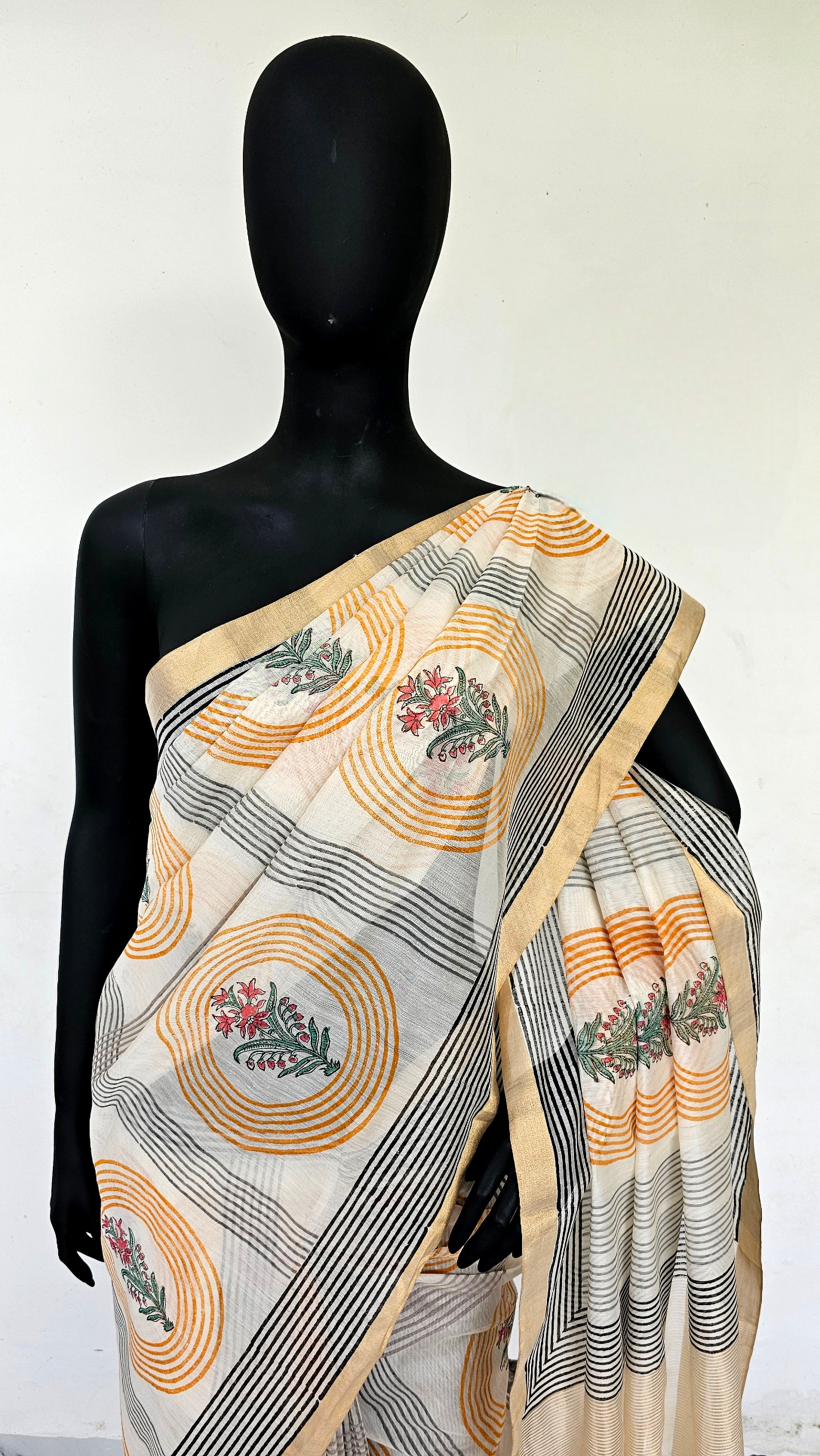 Saree with Hand Block prints and flat Gold Zari Borders.