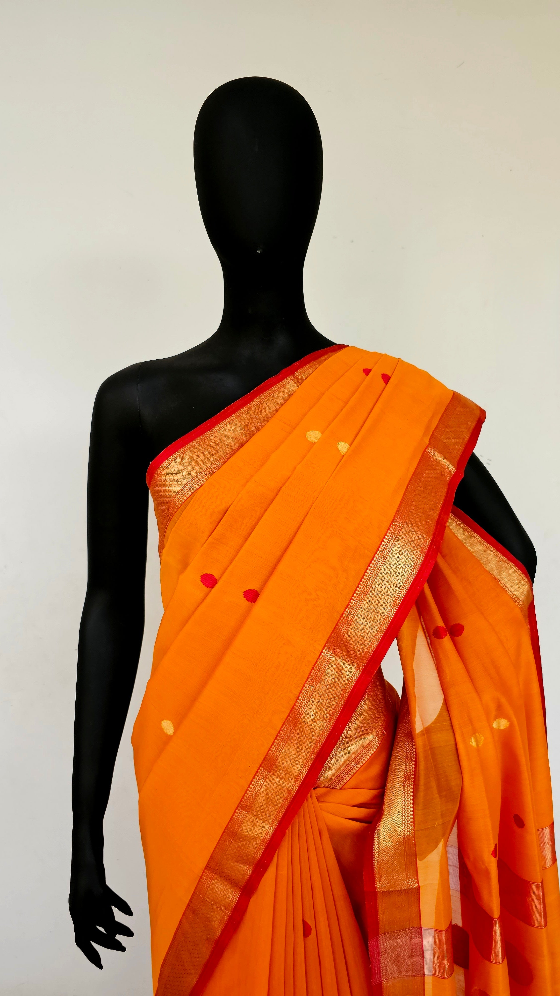 Bright Orange Saree with Booties,Butas and Red/Gold  Zari Borders.