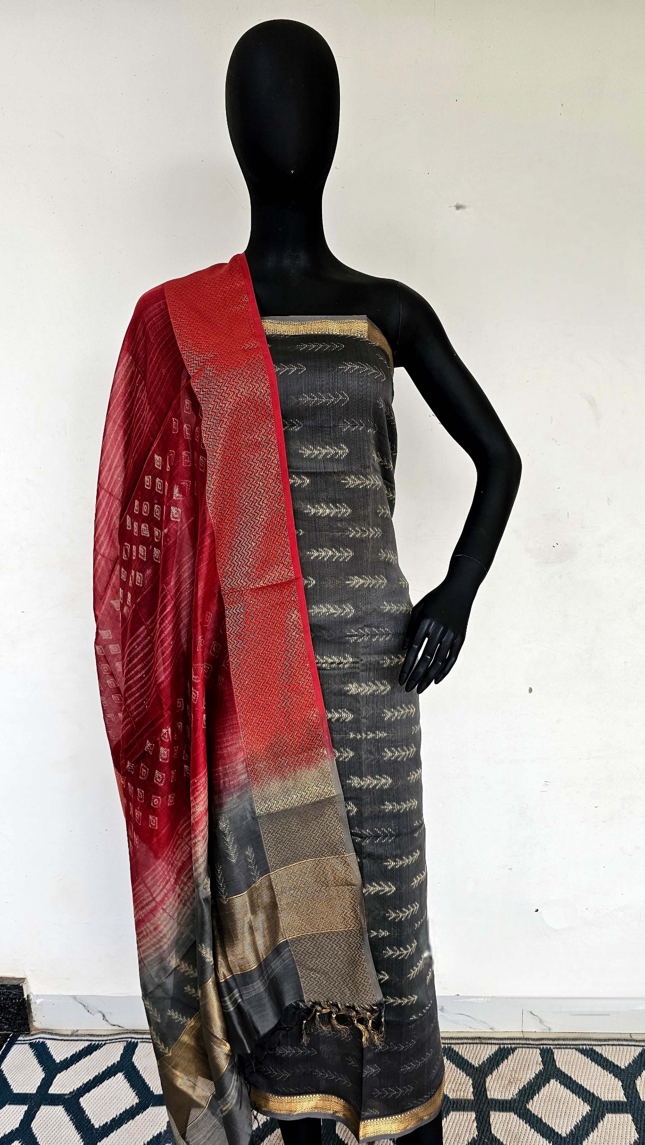 Elevate Your Style with Our Handwoven Silk/Cotton Ensemble, Adorned in Needle Shibori and Gold Zari Borders.