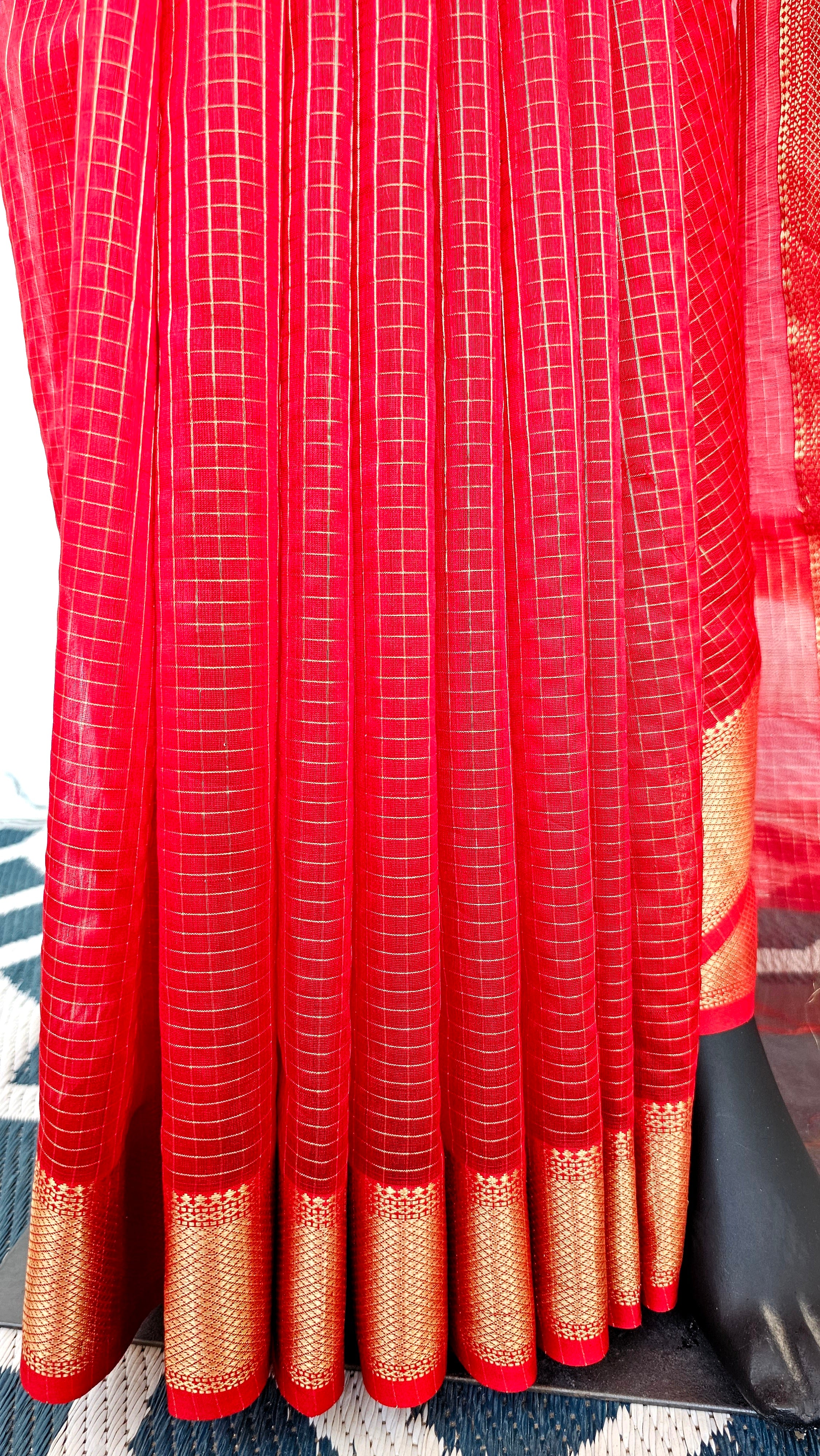 Radiant Elegance: Explore Gold Checks in Ravishing Red with "Chatai" Borders.