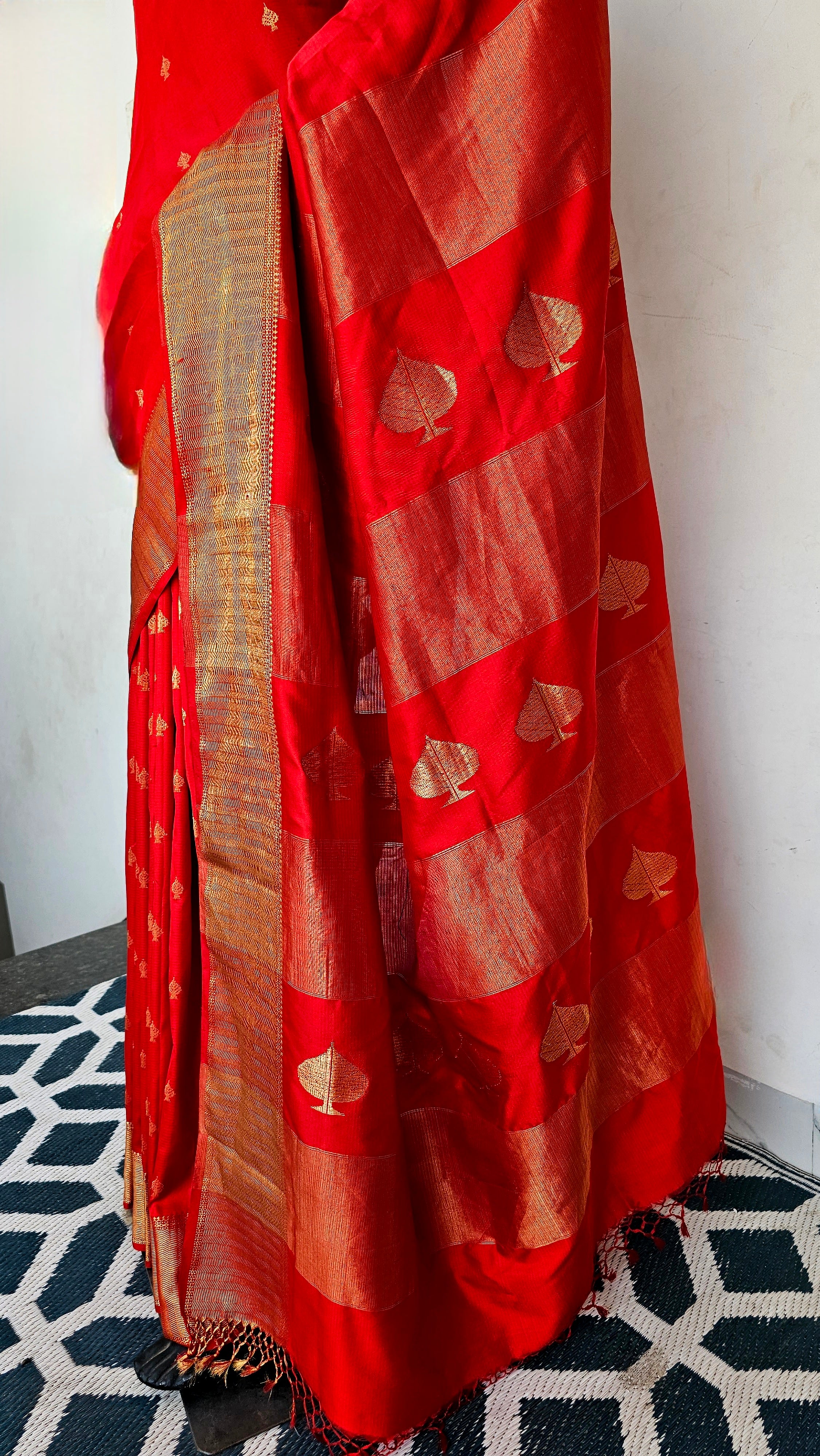 Draped in Desire: "Mashru" Mulberry Silk Saree, "Peepal Patta" Adorned, in Luscious Red.