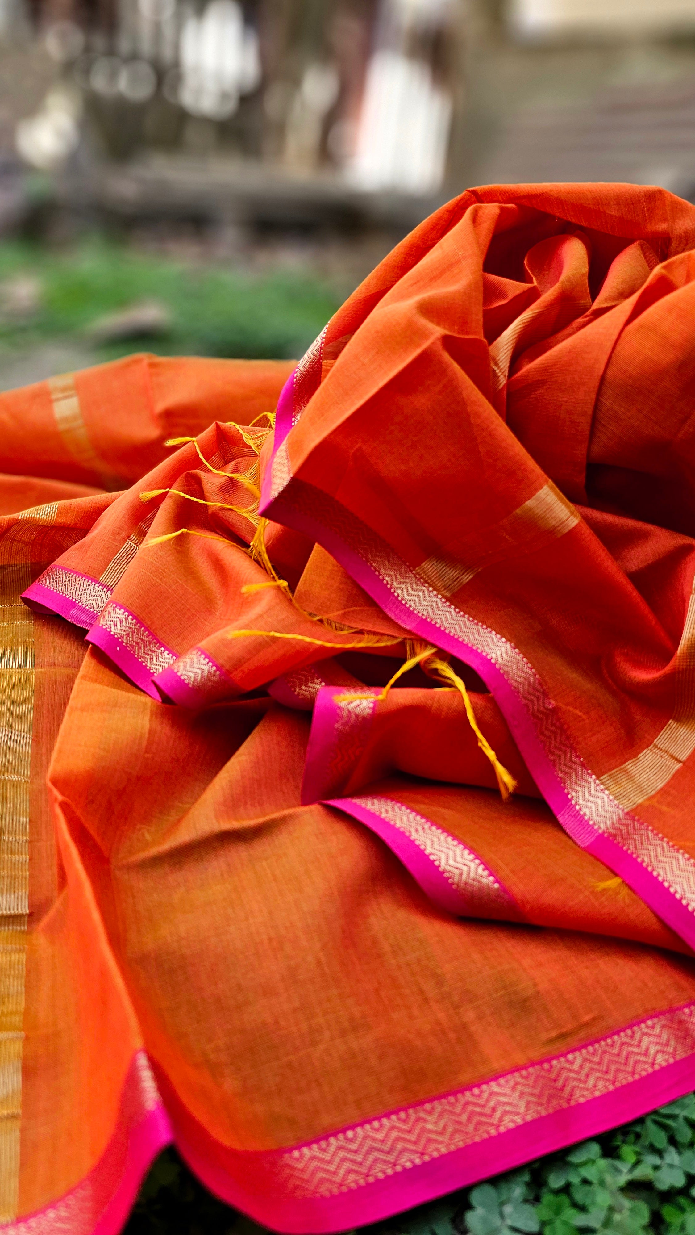 Dupatta in Burnt Orange shade with Pink/Gold Borders.