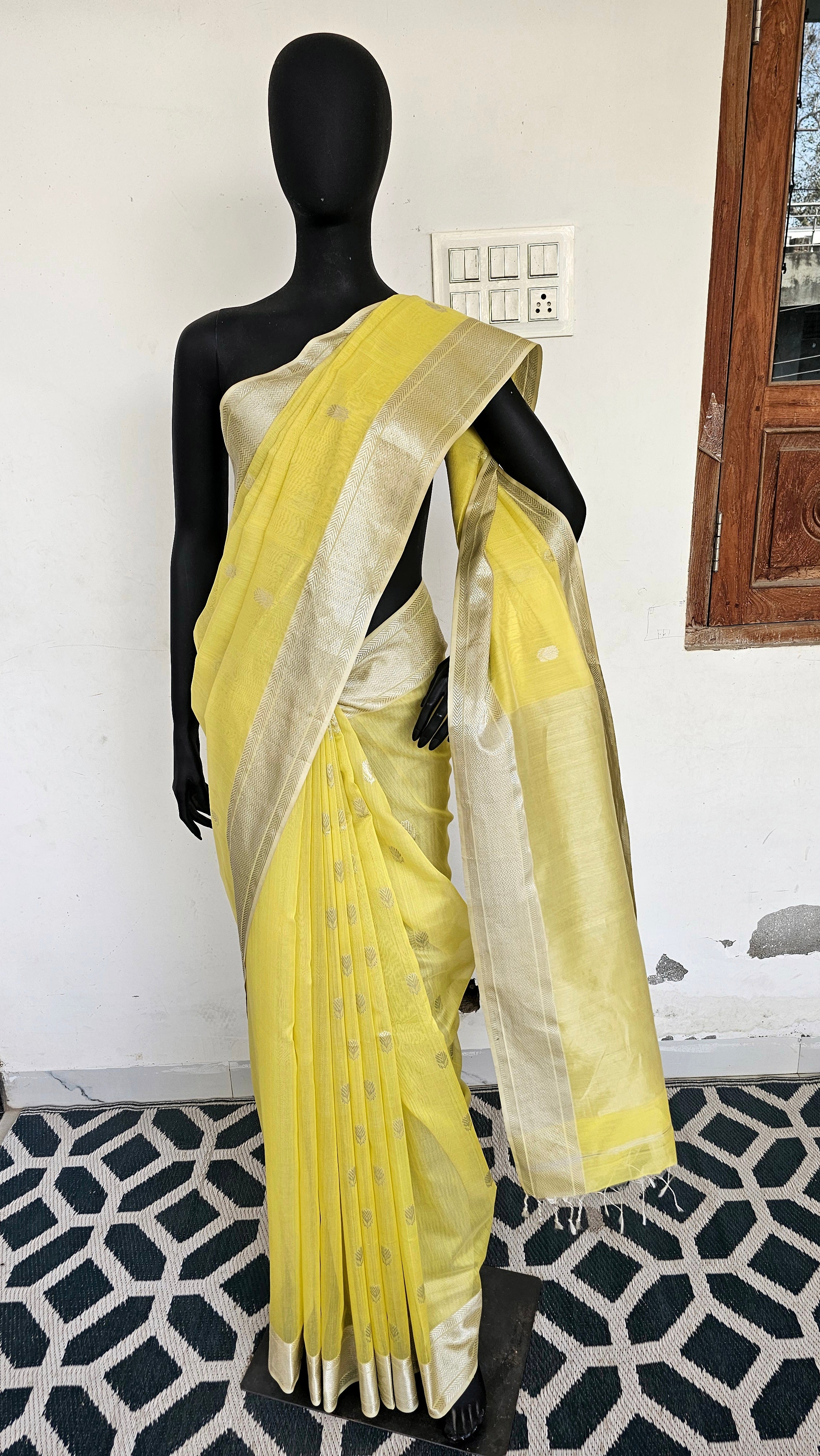 Pastel Yellow Saree with Silver  Booties and Borders.