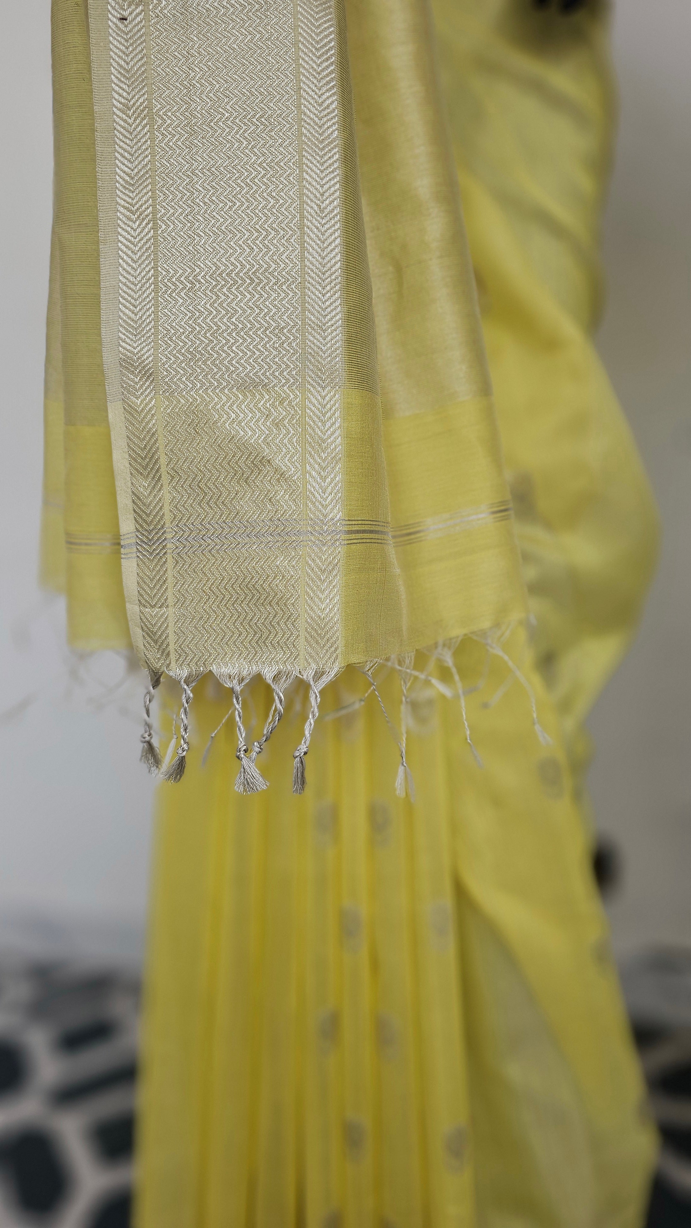 Pastel Yellow Saree with Silver  Booties and Borders.