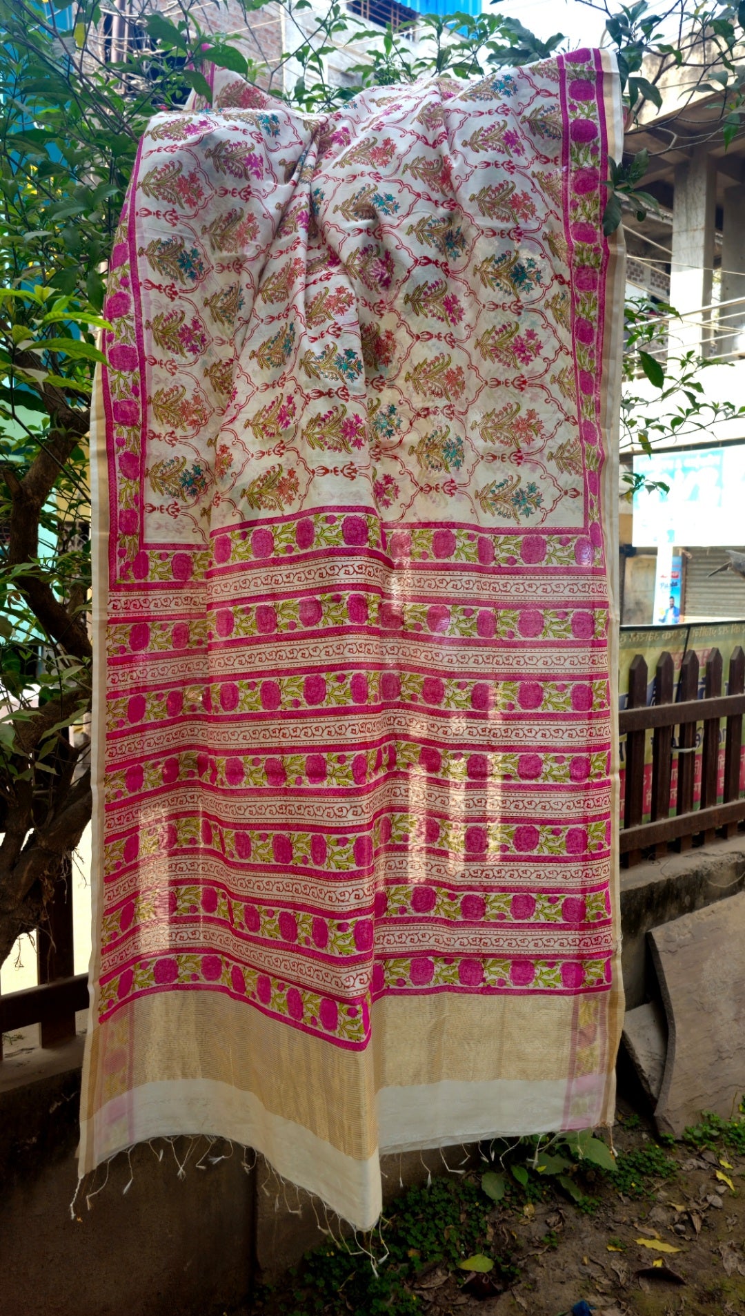 Saree with Multicolor Hand Block prints and Gold Zari Borders.