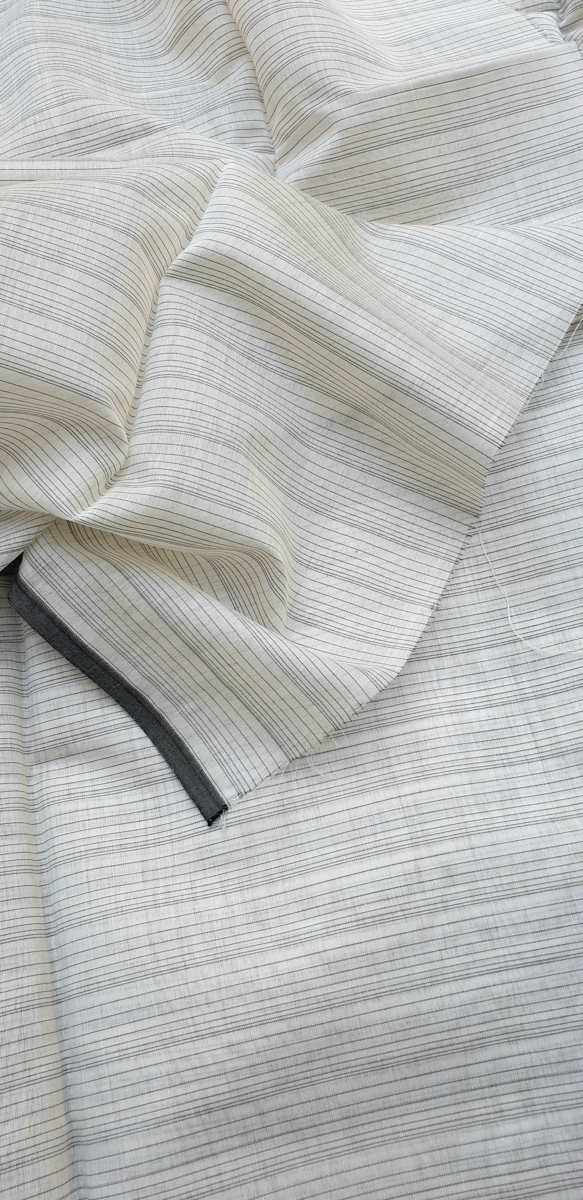 Fabric with Black and White Warp Stripes.