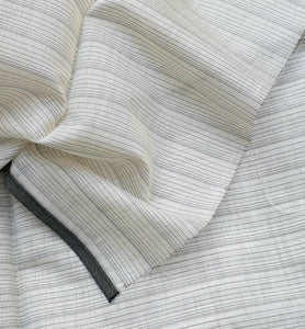 Fabric with Black and White Warp Stripes.