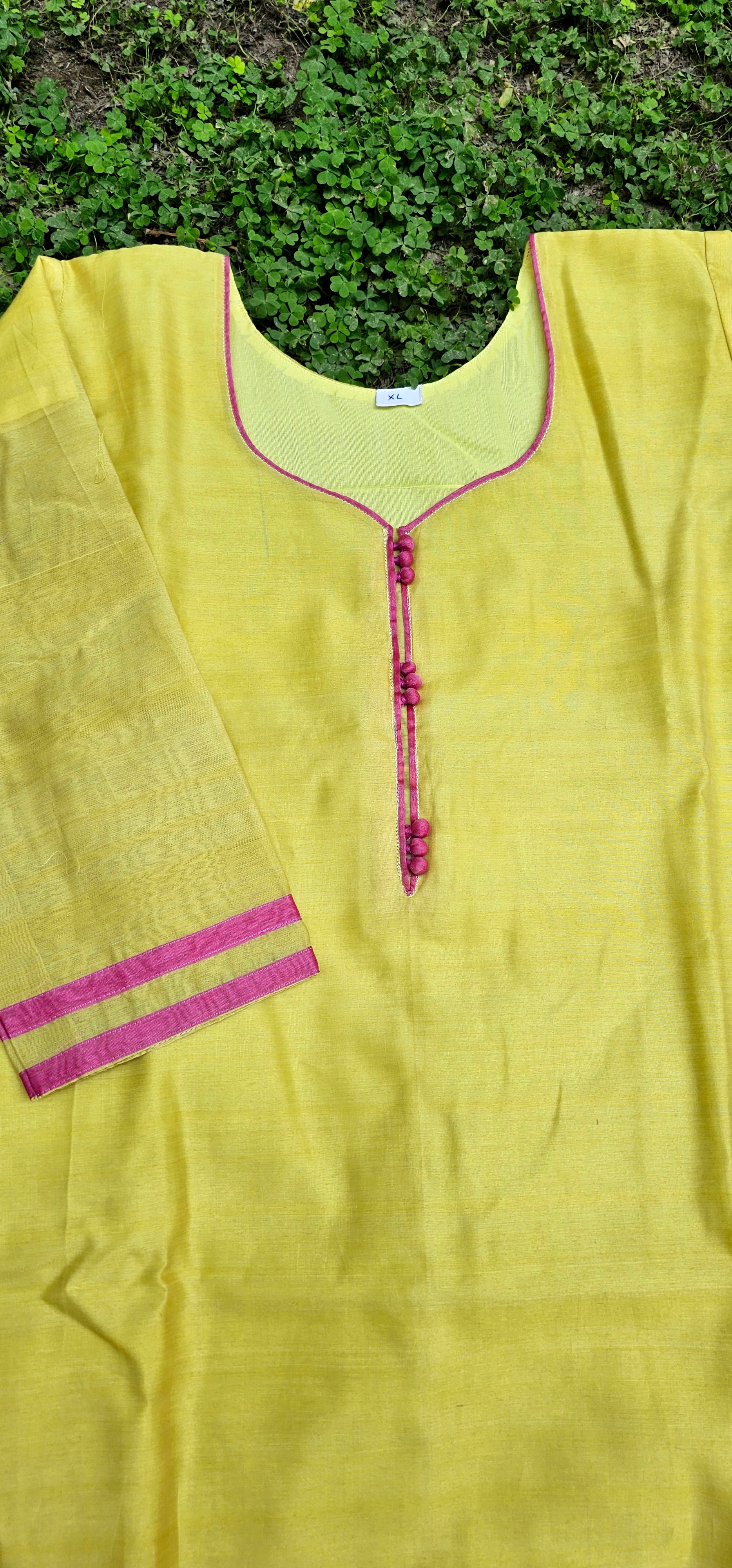 Yellow Kurta with Pink Detailings.