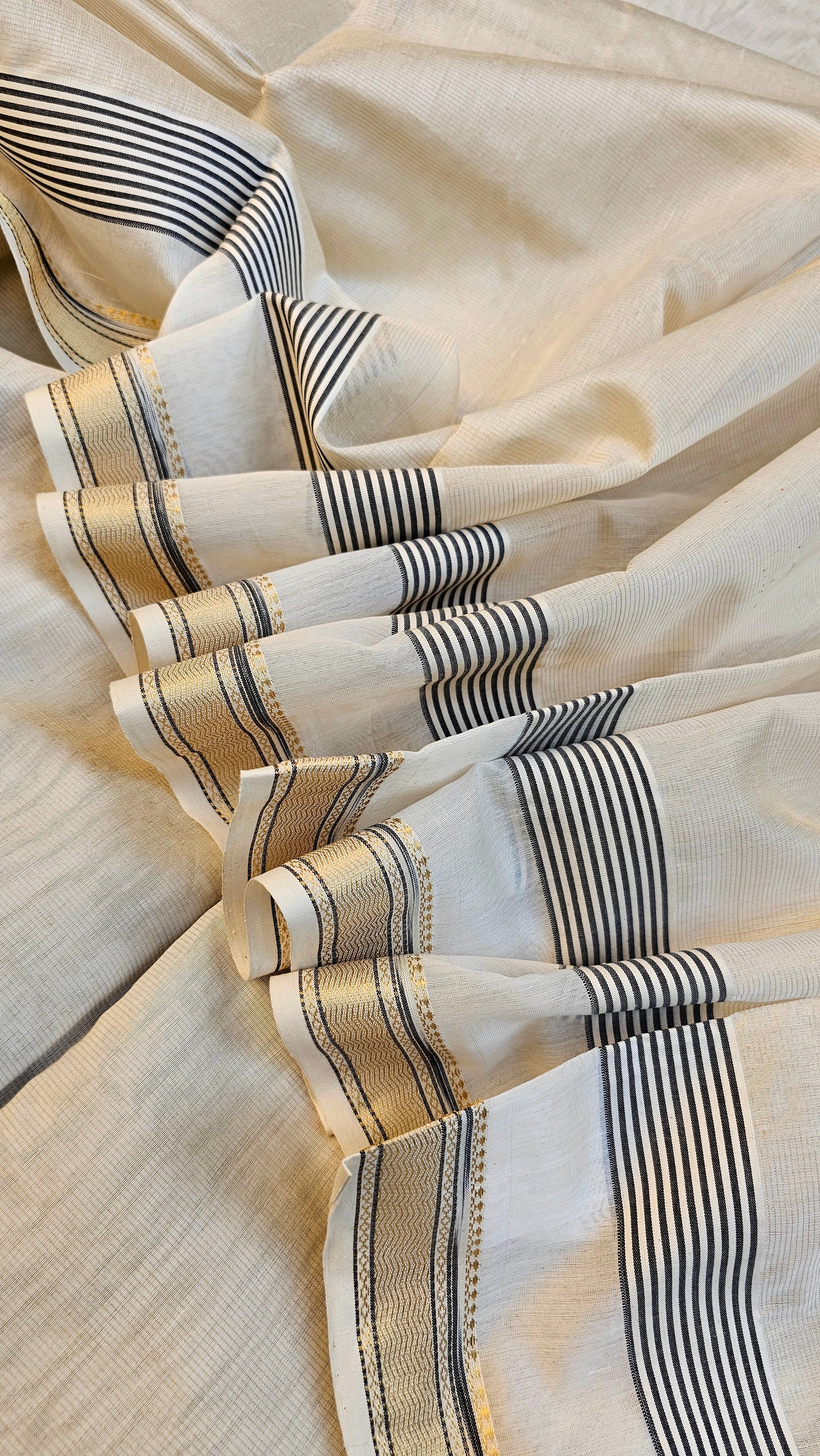 Off White Gold Tissue Saree with Traditional "Katari" Borders.